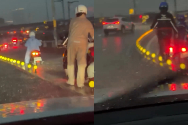 台灣新聞通訊社-影》雨彈狂炸！華江橋機車道沒法騎 騎士曝熄火慘況：淹到膝蓋