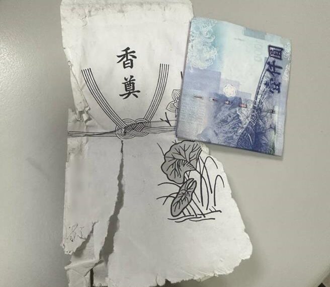 台灣新聞通訊社-路邊「白包」成無字天書 民眾發毛送派出所 警2小時解謎成功