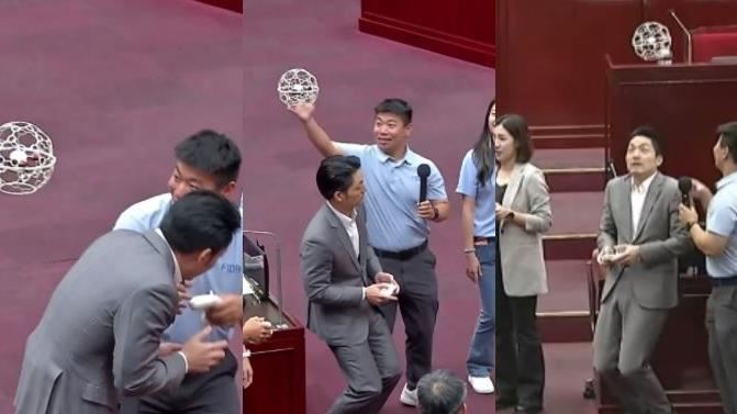 台灣新聞通訊社-差點在議會被球砸！蔣萬安挑戰無人機足球「半蹲、彎腰狂躲球」　畫面曝