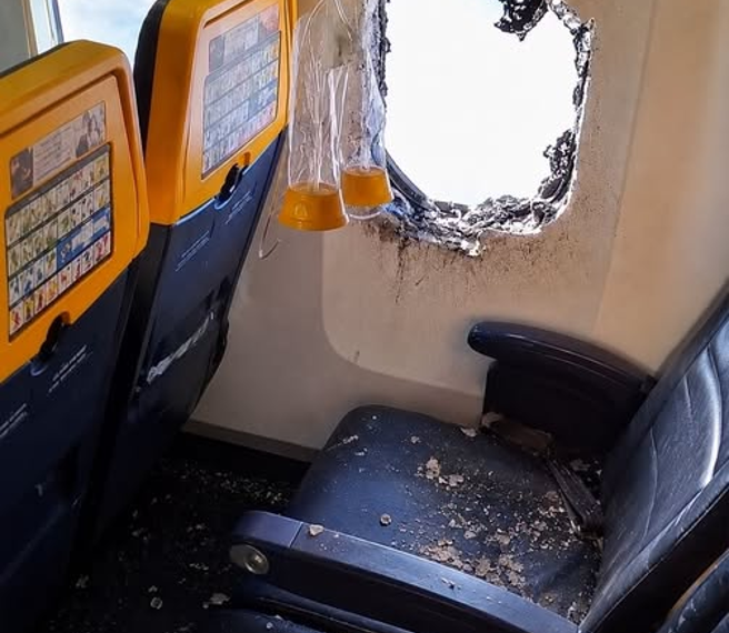 台灣新聞通訊社-2萬英呎高空驚魂！廉航機窗「突爆裂」 男乘客命懸一線